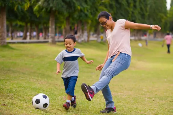 Why did the mom decide to play soccer in her spare time?