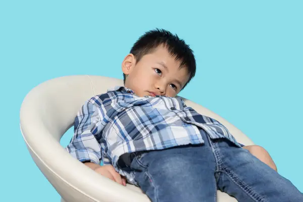 What do you call your son when he just sits around in the same chair all day?