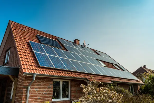 Why did the inventor install solar panels all over his house?