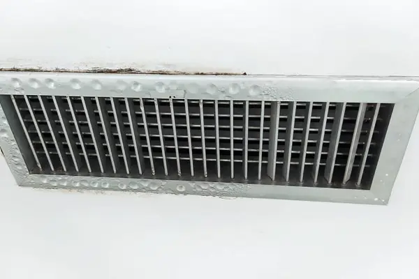 Why was the air compressor dripping with sweat?