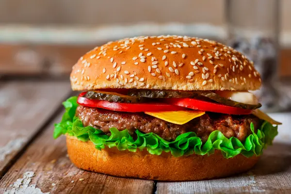 How do you make a hamburger laugh?