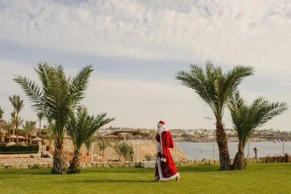 Why does Santa love to work in the garden?